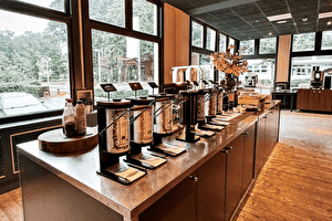 Restaurant of Amrâth Berghotel Amersfoort with a buffet and a long counter for guests.