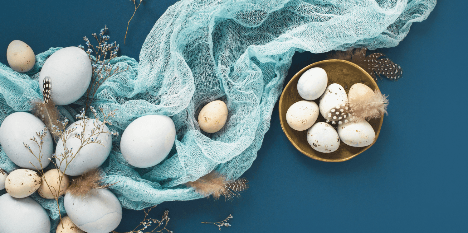 Passing eggs on a blue background with a blue fabric underneath